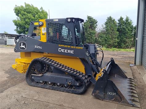 john deere skid steer on a tariler|john deere skid steer.